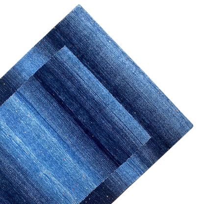 Blue Gabbeh rug with clear rectangular stripes, diagonal view of the pattern