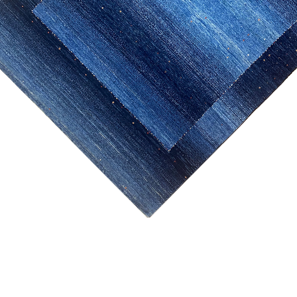 Blue Gabbeh rug, detail of the pile and stripe blocks at one corner