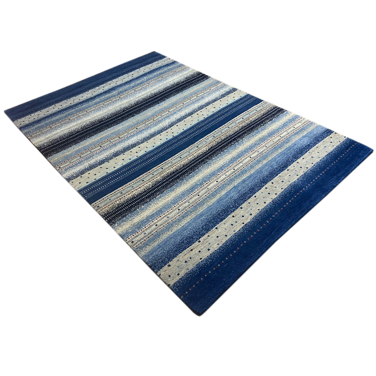 Gabbeh rug viewed from the side: striped design in blue and cream