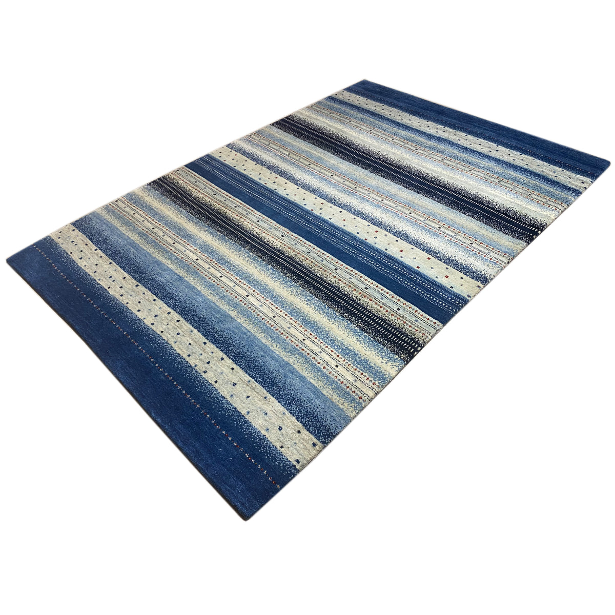 Gabbeh rug at an oblique angle, stripes in light blue, beige, and dark blue