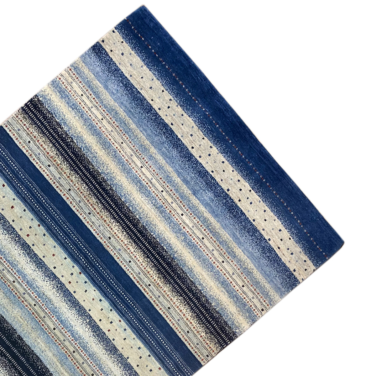 Gabbeh rug shown at a diagonal angle, with stripes in light blue, beige, and a dark border