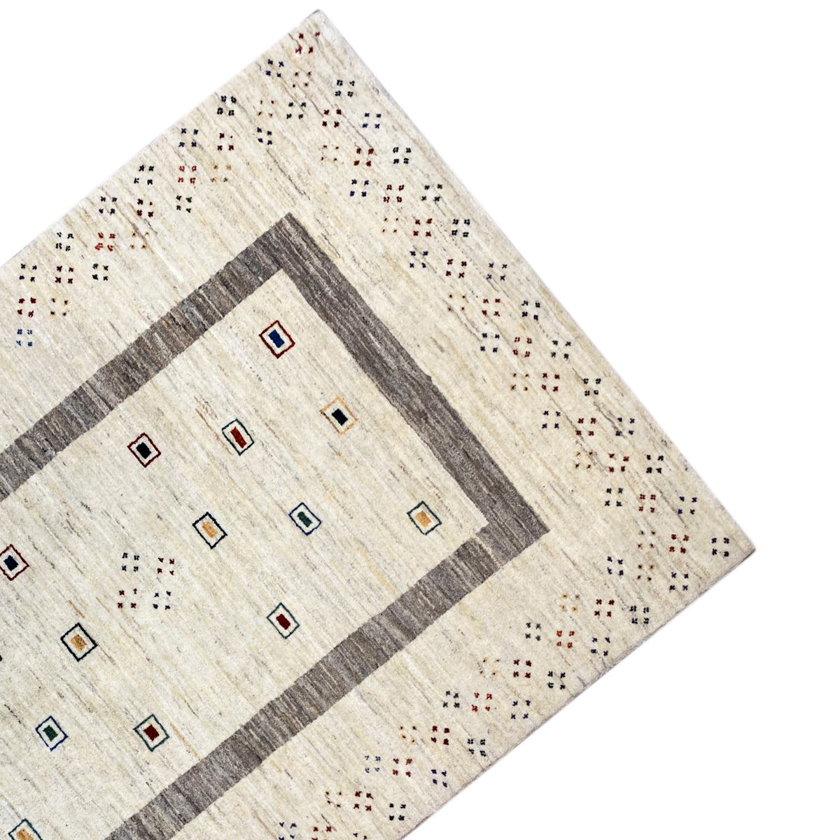 Corner of the rug: beige background with a gray border and multicolored squares