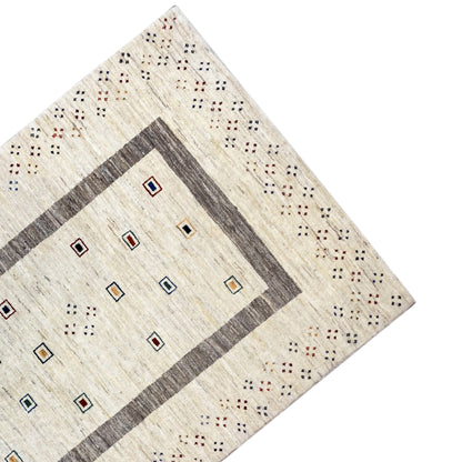 Corner of the rug: beige background with a gray border and multicolored squares