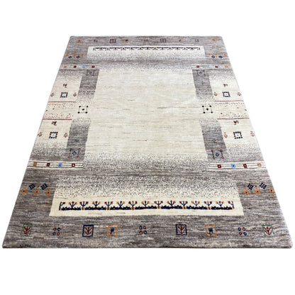 Gabbeh rug in beige/gray with a border and small ornaments in the corners