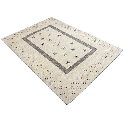 Beige Gabbeh rug with a diamond-cut design, central pattern, and multicolored grid dots