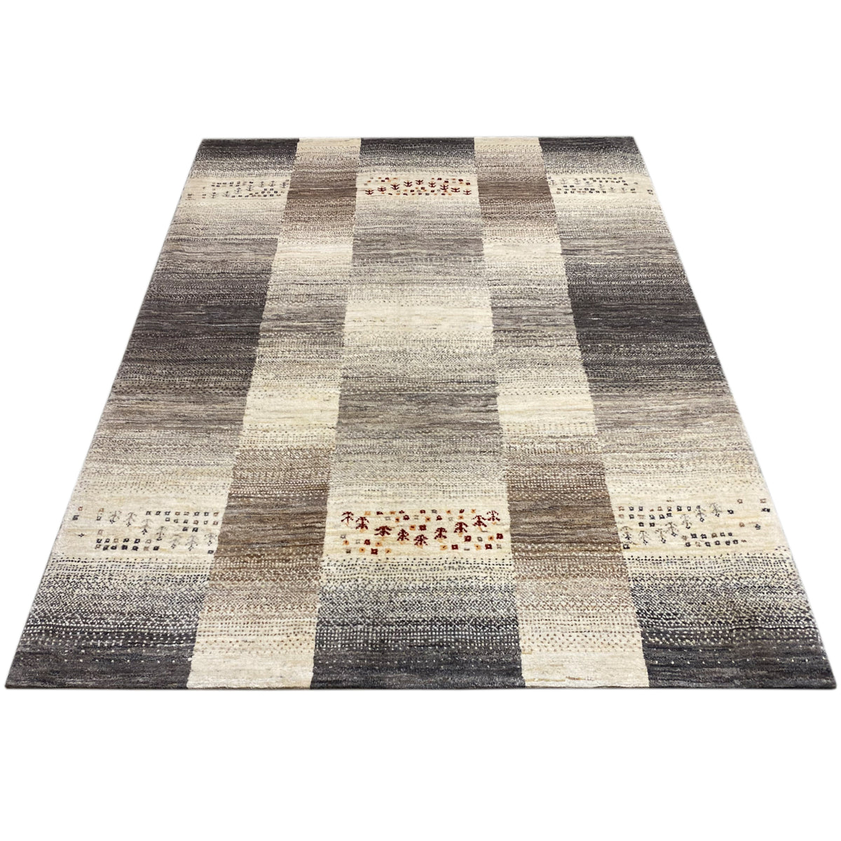 Gabbeh rug, laid out flat: stripe and block pattern in dark gray and cream