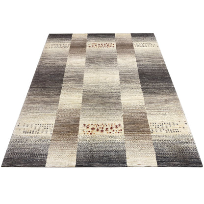 Gabbeh rug, laid out flat: stripe and block pattern in dark gray and cream