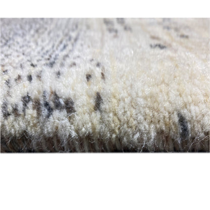 Gabbeh rug close-up of the pile surface in cream with dark gray sections