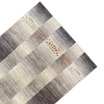 Gabbeh rug detail: checked geometric pattern in light and dark gray, cream with red stripes