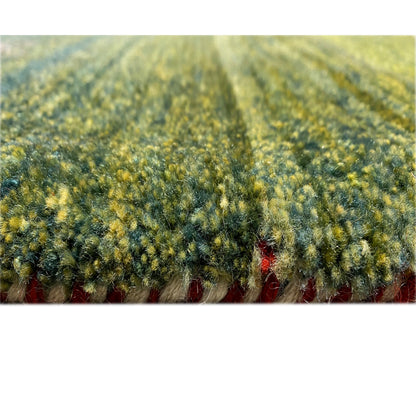 Gabbeh rug with a dense pile, greenish-yellow texture, and delicate pattern impressions