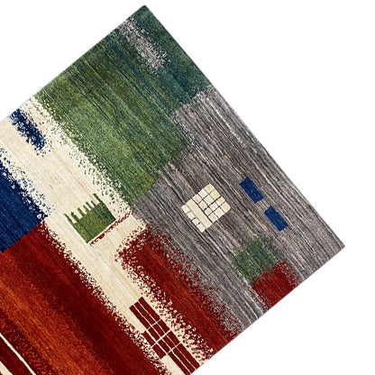 Gabbeh rug corner with a green block, gray-striped area, and blue accents