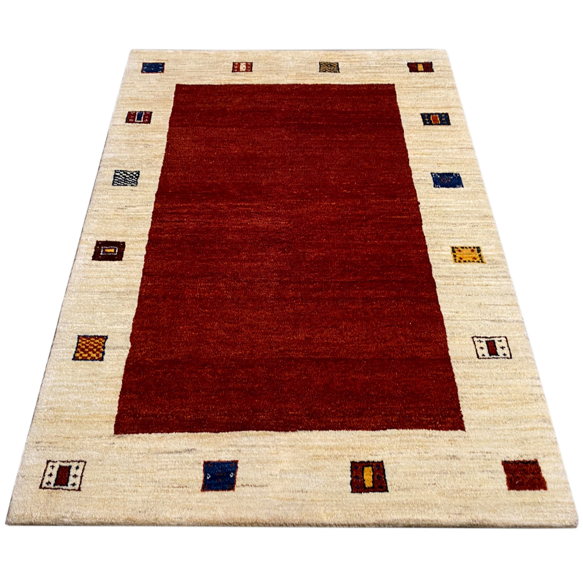 Rug with a red center, beige border, and colorful squares featuring symbols