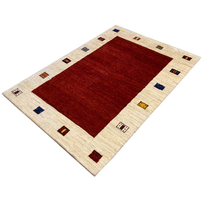 Rug with a red center and beige border, framed by multicolored squares