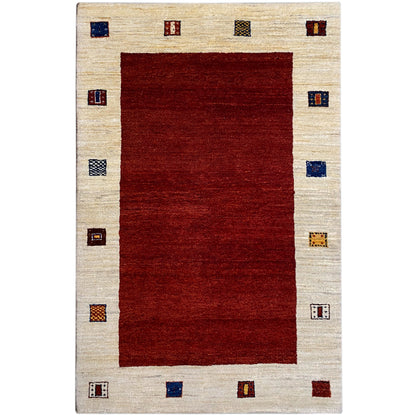 Gabbeh rug with a red rectangle, beige border, and colorful squares