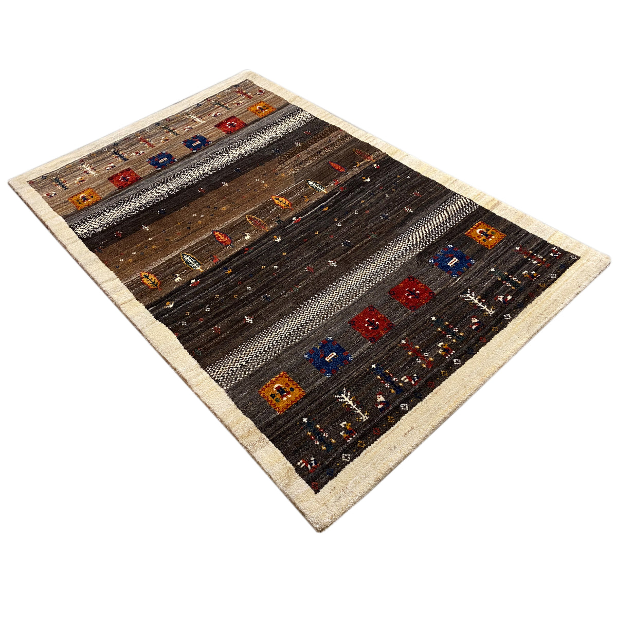 Rug viewed at an angle, dark brown with a beige border and colorful checkered patterns