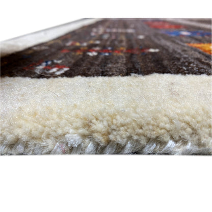 Carpet edge with beige pile; above it, a dark patterned area.