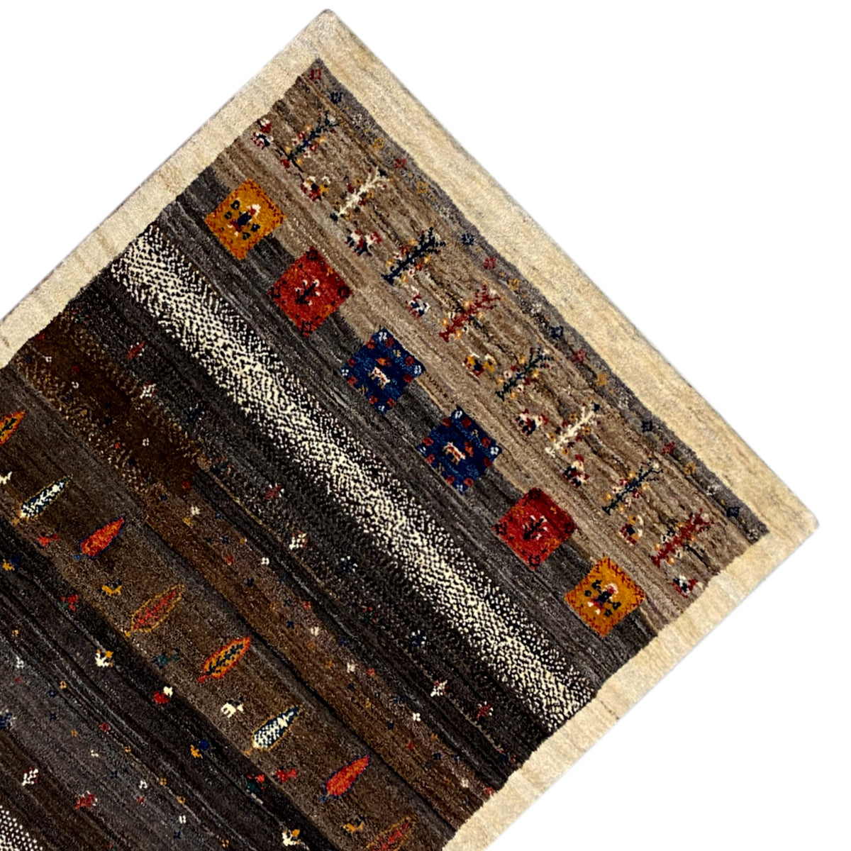 Corner of a rug with a beige border and orange-blue-red patterns on a dark background.