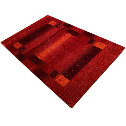 Gabbeh rug, red, diagonal view with a graphic square design