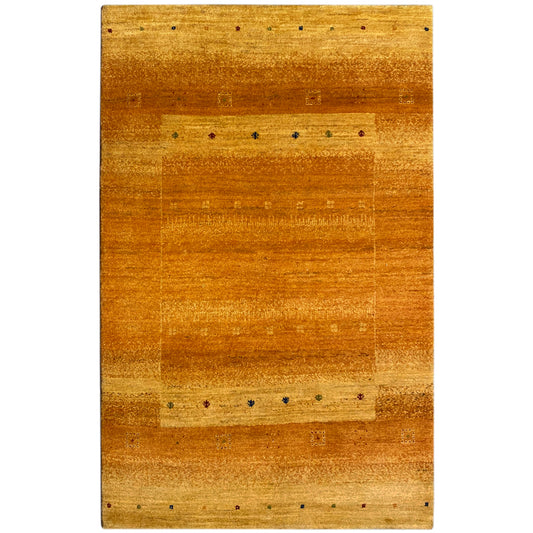 Gabbeh rug in honey brown with fine lines and small multicolored dots