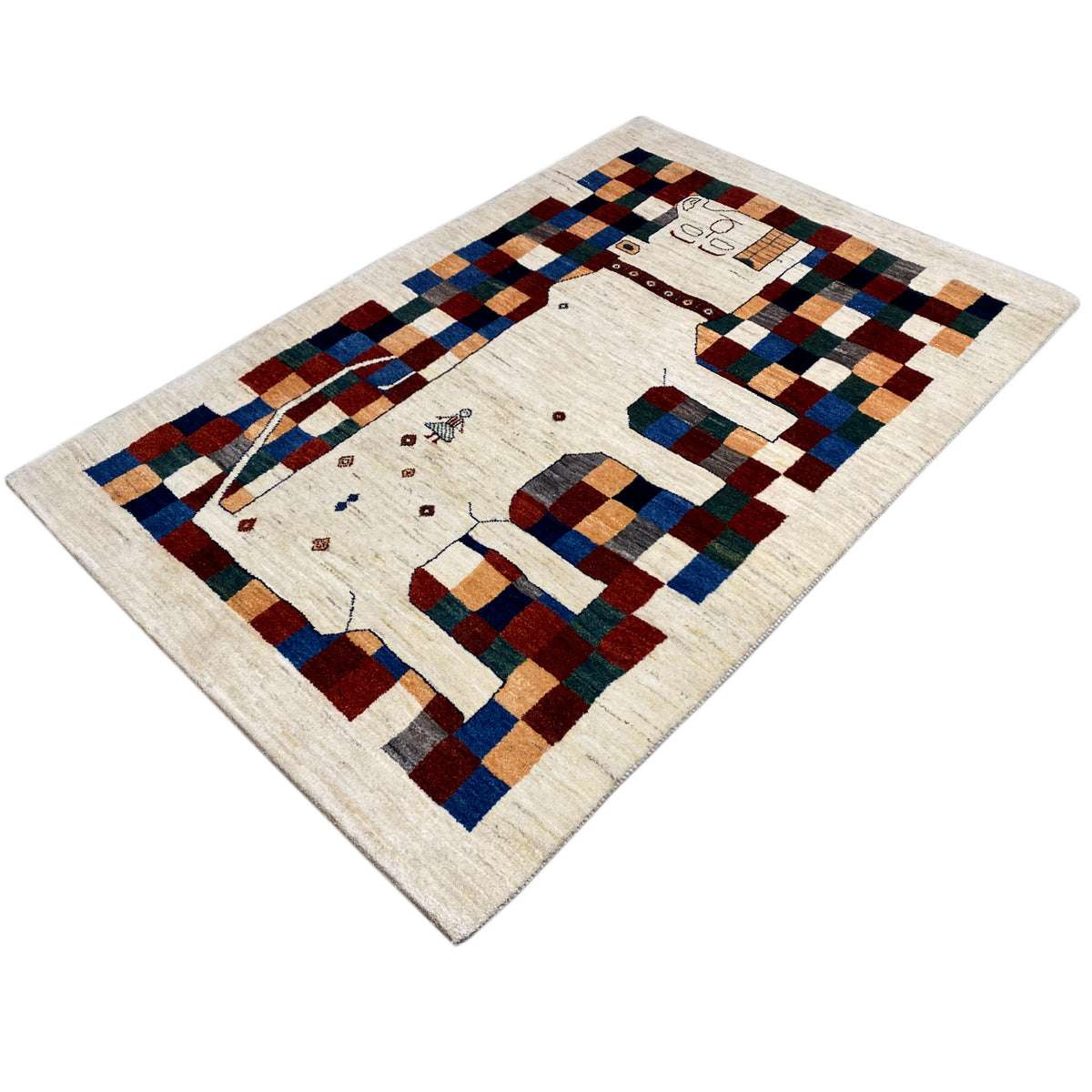 Gabbeh rug 180x119 cm, photographed at an angle: cream-colored background with geometric block checks