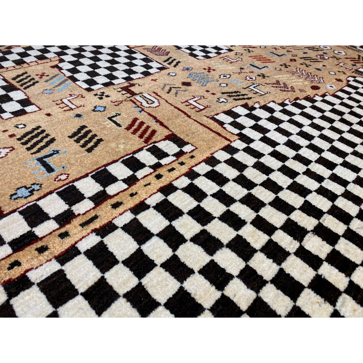 Close-up: black-and-white checkered pattern and beige tribal motif with colorful accents