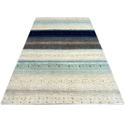 Gabbeh rug with a flat striped pattern in shades of blue, gray, and beige