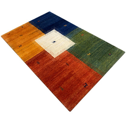 Gabbeh rug (184x124 cm) at an angle: multicolored blocks with small animal motifs