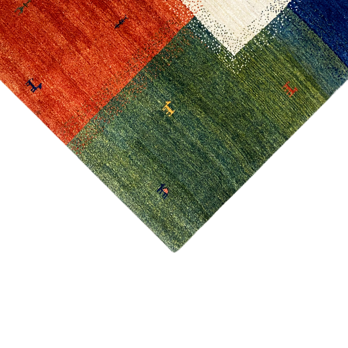 Gabbeh rug (184x124 cm) in close-up: green and red fields with small animal motifs along the edge