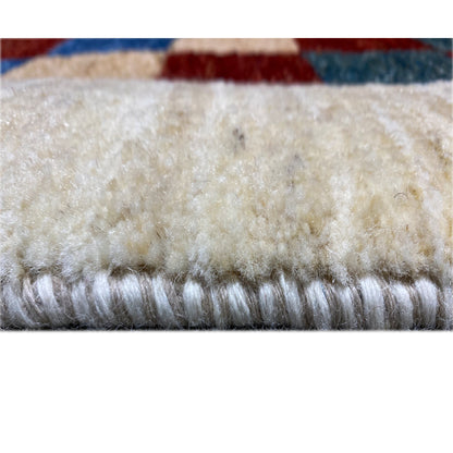 Gabbeh rug 182 x 120 cm, close-up of the pile edge with a dense, light wool texture