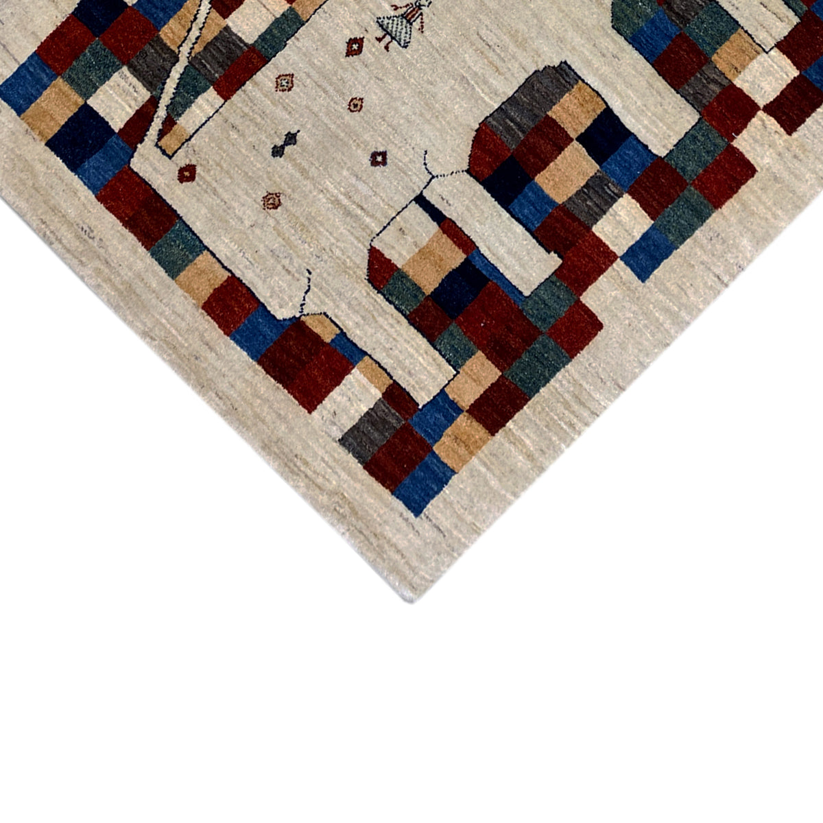Gabbeh rug 182 x 120 cm, corner detail: beige background with a colorful checkered pattern