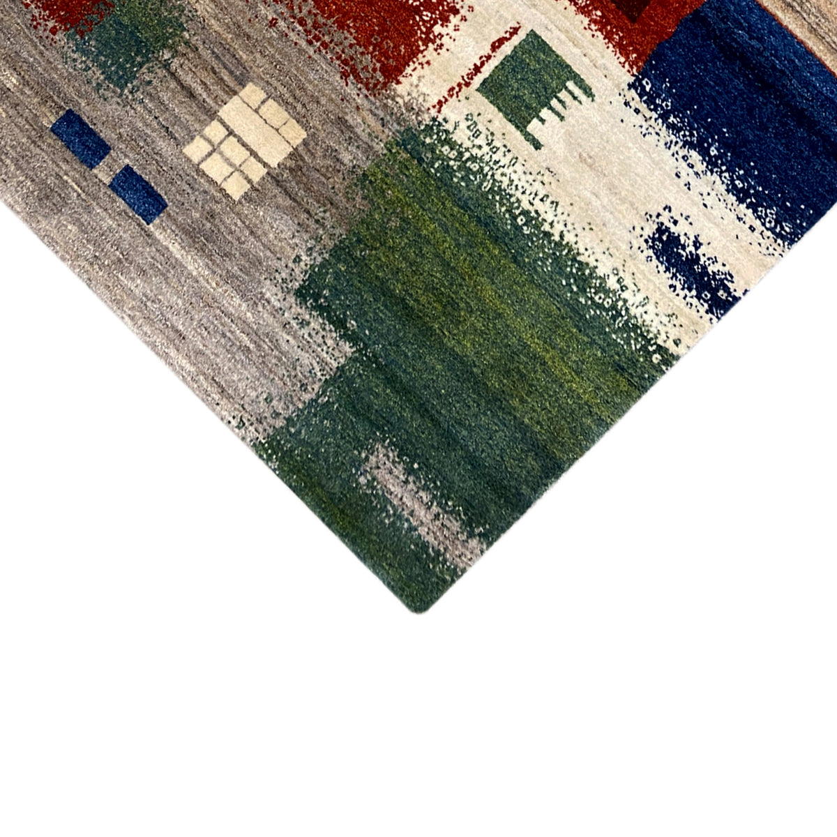 Gabbeh rug 186x125 cm Detail on the edge: gray, green, and red patches of color