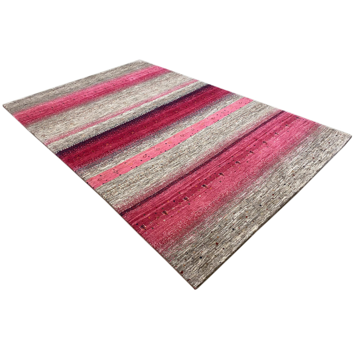 Gabbeh rug in pink and gray with a striped pattern, laid diagonally