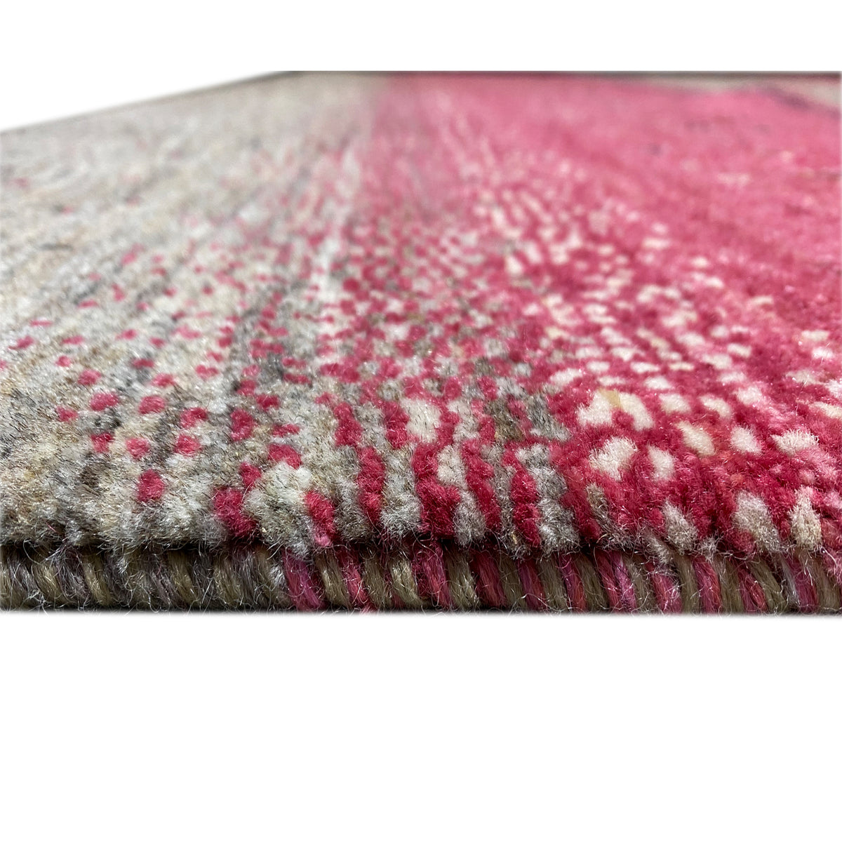 Gabbeh rug edge with fringes: pink-gray pattern and woven texture