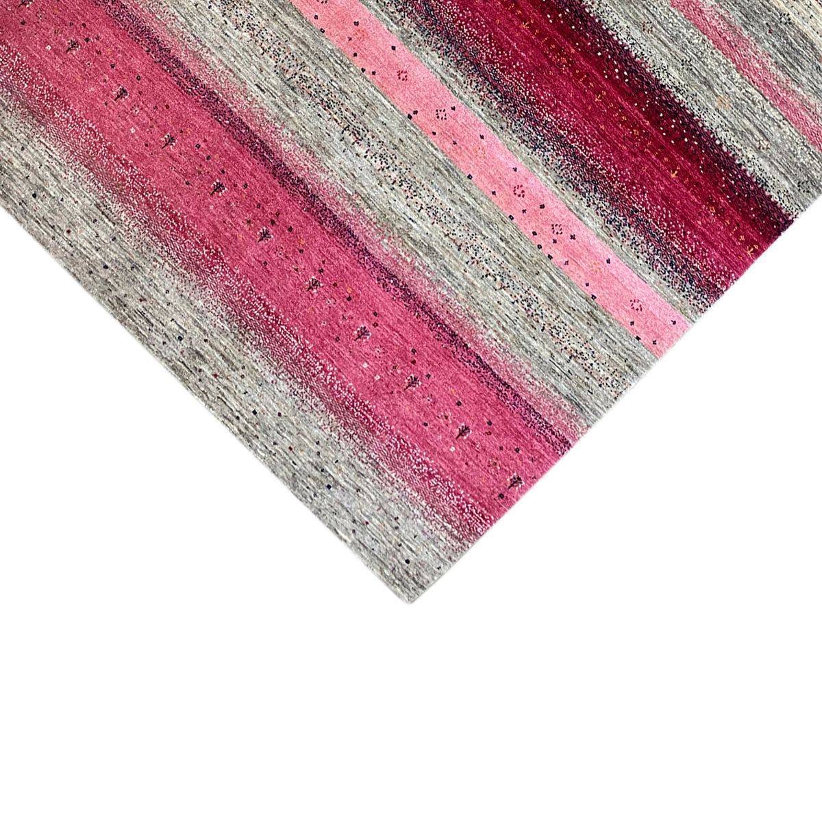 Gabbeh rug close-up: horizontal mix of stripes in pink and light gray