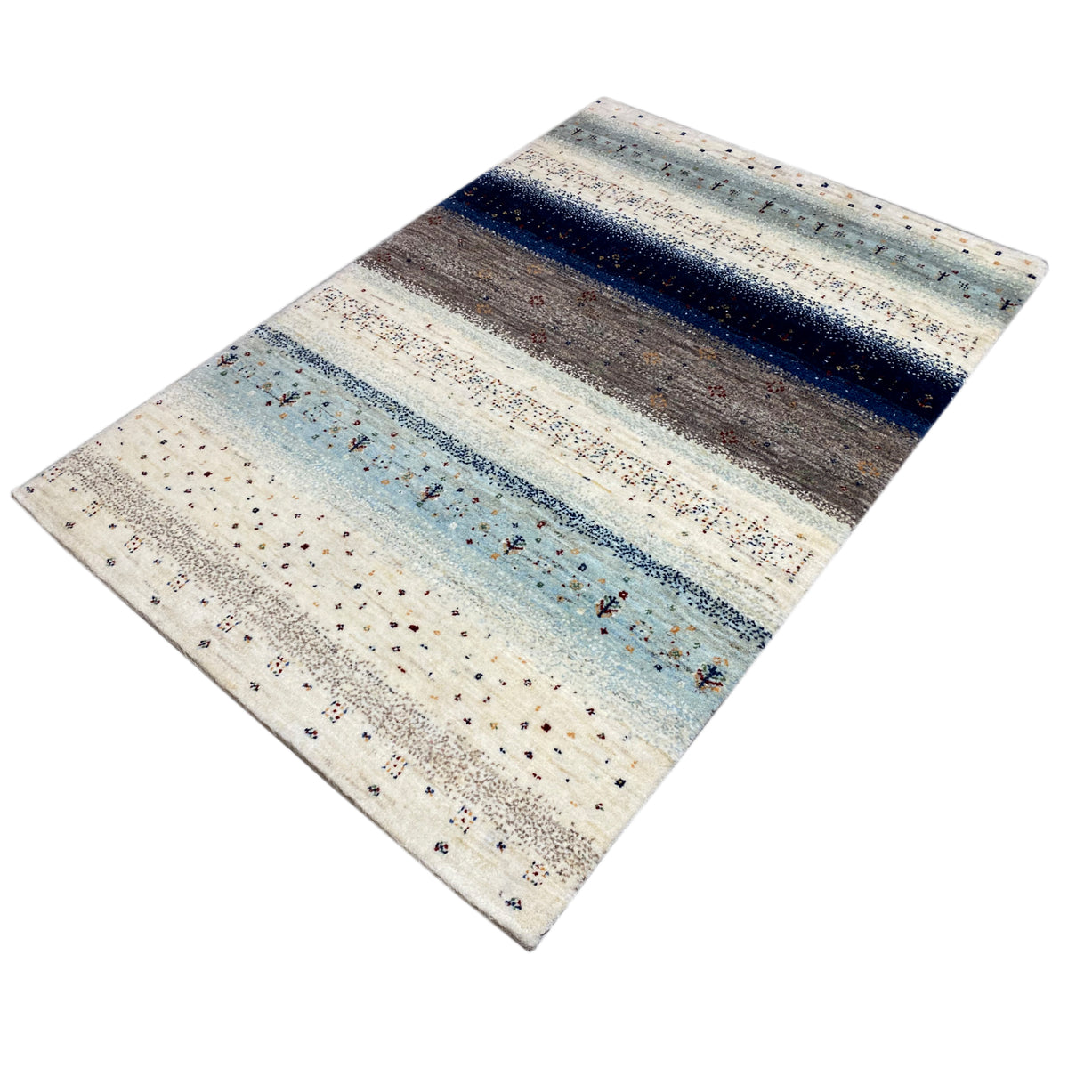 Gabbeh rug from the side, light base with blue and gray zones