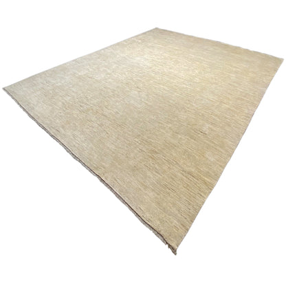 Gabbeh rug in light beige, photographed at an angle, with a fine, speckled texture