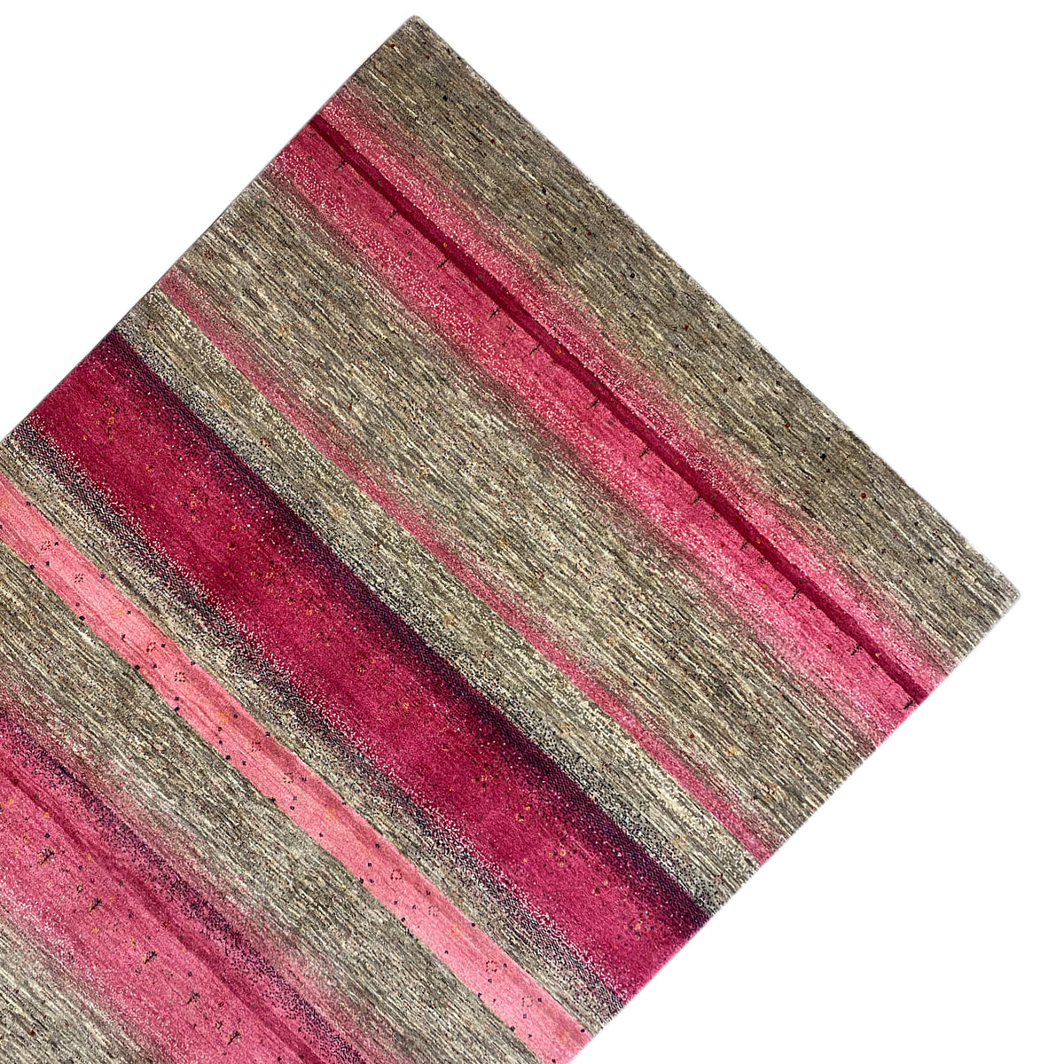 Gabbeh rug from a diagonal overhead view: stripes in shades of pink and gray