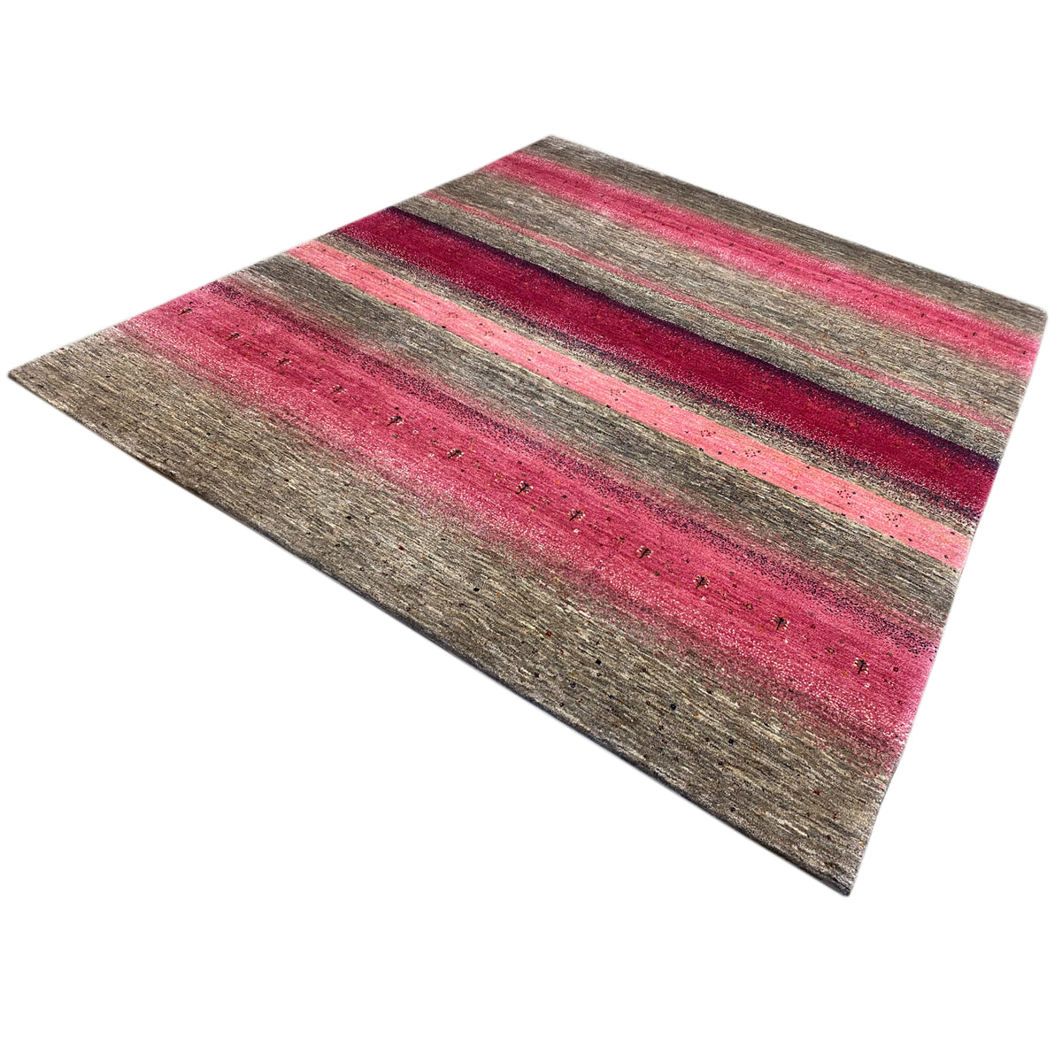 Gabbeh rug at an angle: pink-gray stripes