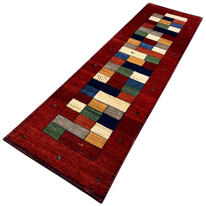 Red Gabbeh rug runner, elongated rectangle with a central square mosaic and colorful border