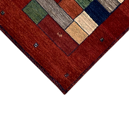 Gabbeh rug runner corner, red with geometric color blocks and small dark dots