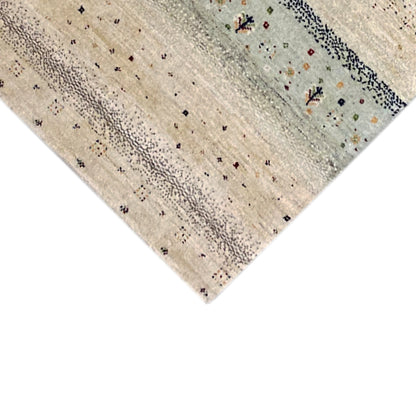 Gabbeh rug runner corner with delicate dot motifs in beige and turquoise blue