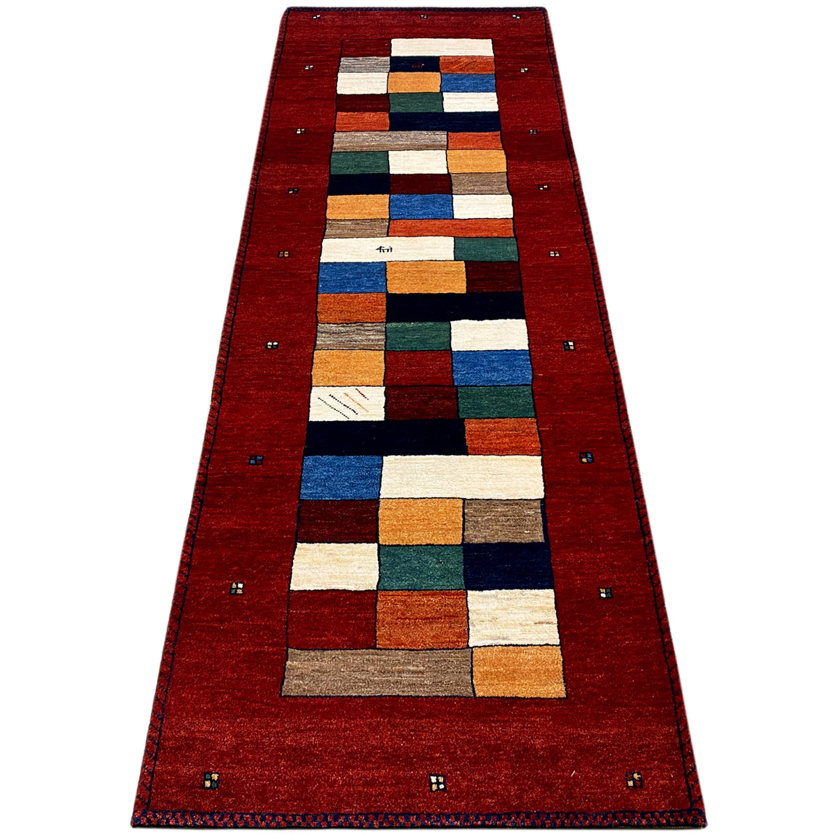 Red Gabbeh runner rug, central cube pattern in white, orange, blue, and green