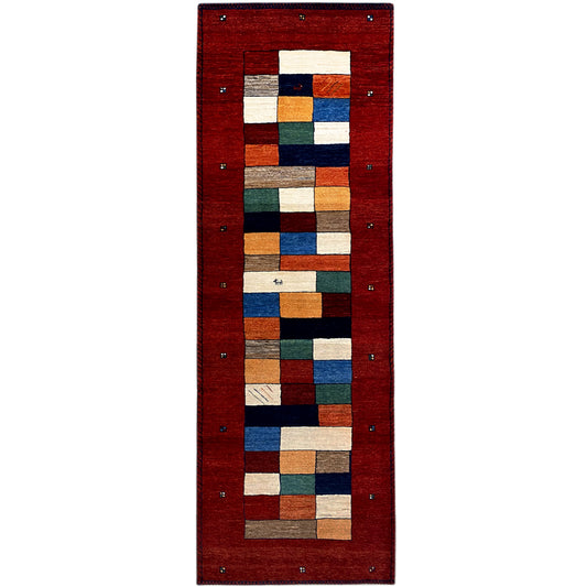 Red Gabbeh runner with geometric patchwork in blue, green, beige, and border