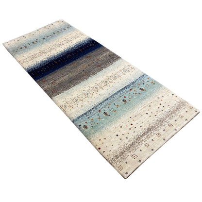 Gabbeh rug runner with diagonal light blue and gray stripes and delicate dotted detailing