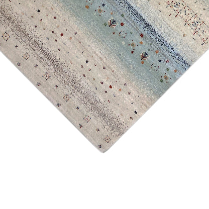 Gabbeh rug runner corner: light pile texture with a blue pattern and colorful dots