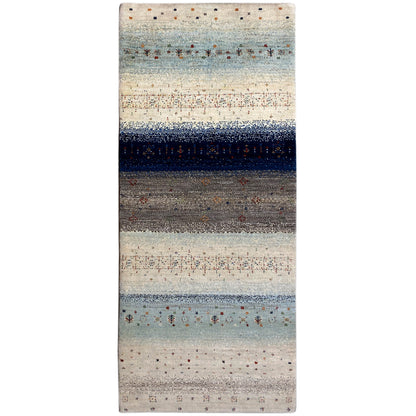 Gabbeh runner rug with a light beige background, blue-gray stripes, and colorful patterned dots