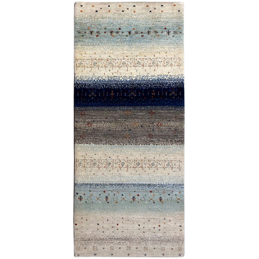 Gabbeh runner rug with a light beige background, blue-gray stripes, and colorful patterned dots
