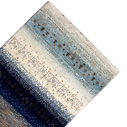Gabbeh rug runner, side view: blue striped pattern with small ornaments in the center