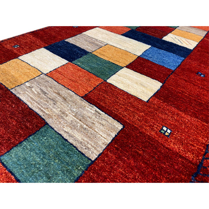 Detail view: Red Gabbeh runner rug with mixed tiles in beige, blue, and green