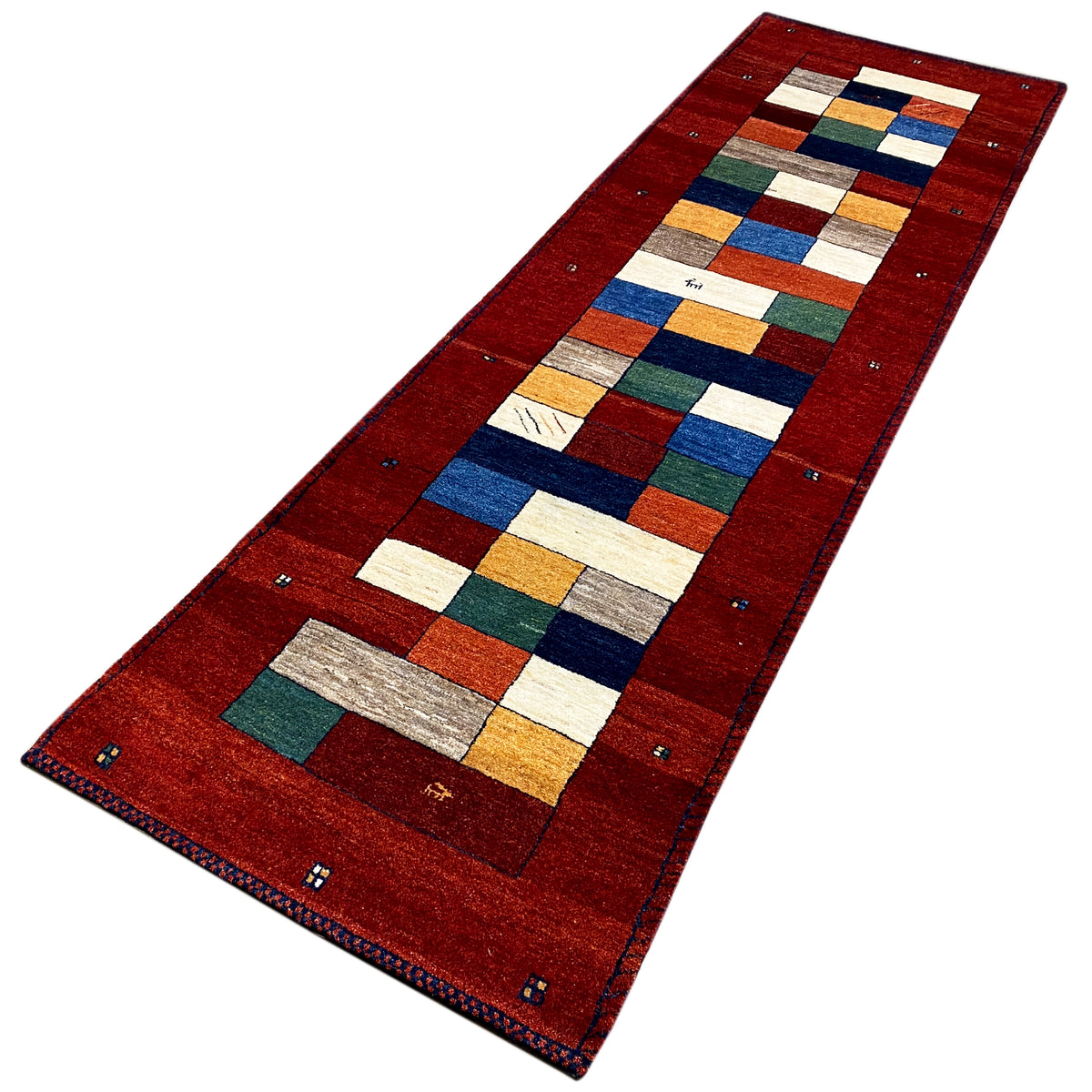 Red Gabbeh runner rug with multicolored square and rectangular areas.